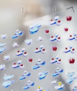 Close-up detail of oil painting style lotus nail stickers with matte semi-transparent finish