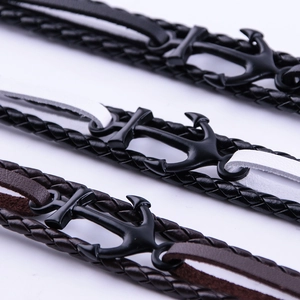 Three vintage anchor leather bracelets in black and brown weave with metal clasps