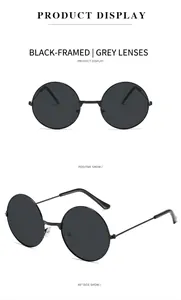 Detailansicht der runden Sonnenbrille mit schwarzem Metallrahmen und grauen Gläsern