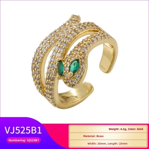 Detailed shot of a gold-plated brass snake ring set with white and green zircons