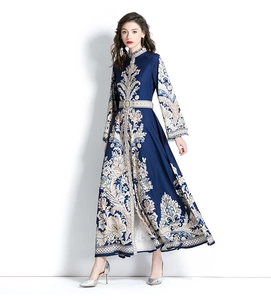 Detail of floral paisley maxi dress with trumpet sleeves and matching buckle waist belt
