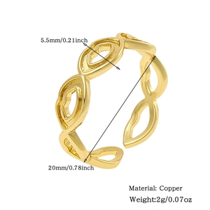 Detailed close-up of a 18K gold-plated copper open ring featuring hollow eye pattern