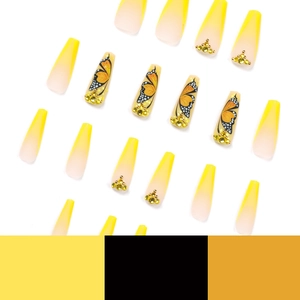 Yellow French tip press-on nails with butterfly patterns and crystal rhinestones