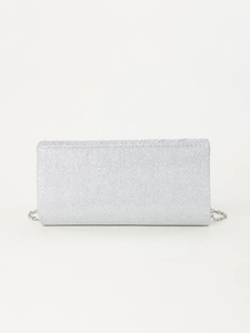 Detail showing the silver glitter texture and metallic chain of this elegant clutch bag