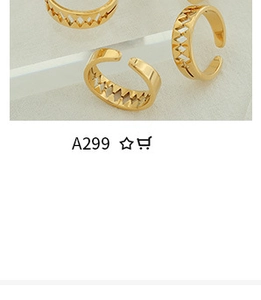 Detailed macro shot of four gold-plated hollow geometric open rings on a clear surface