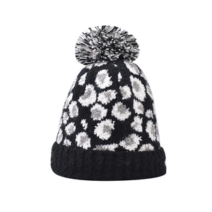 Chic leopard print knit beanie with a fluffy pom-pom and folded cuff for women