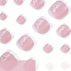 Glossy pink square press-on toenails with white French tips and floral designs