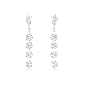 Detailed view of silver dangle earrings featuring pear and round cut sparkling crystals