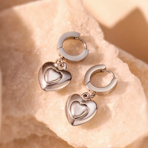 Polished silver heart drop earrings with a sleek double-layered hollow heart design