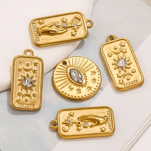 Tarot style gold pendants with 3D star moon sun patterns and embedded cubic zirconia