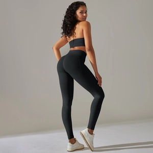 Close-up of black seamless knit yoga set with high-waisted leggings and sports bra