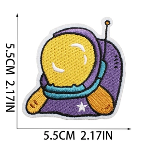 Detail view of astronaut embroidered patch showing 5.5cm size and precise stitch work