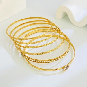 7-piece gold-plated bracelet set with rhombus patterns and sparkling zircon stones