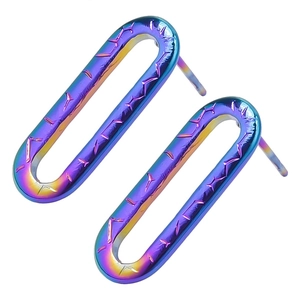 Macro detail of geometric rainbow stainless steel earrings with fine star engraving