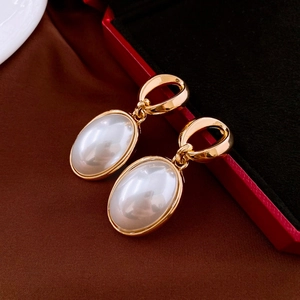 French vintage oval pearl earrings with golden geometric frames for women fashion