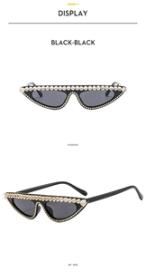 Detailed views of black cat-eye sunglasses with luxury rhinestone trim and dark lenses