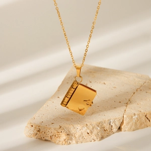 Gold book locket pendant necklace with heart engraving on minimalist stainless steel chain
