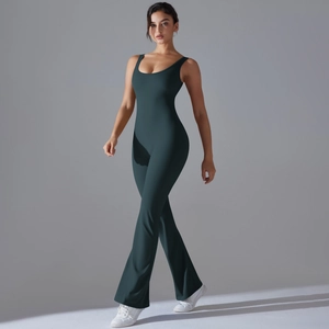Detail view of dark green yoga jumpsuit with flared legs and athletic cut