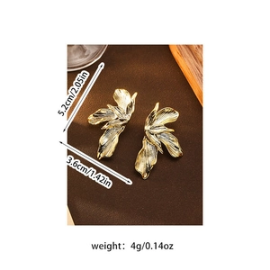 Detailed view of gold flower earrings with size measurements 5.2cm by 3.6cm and weight