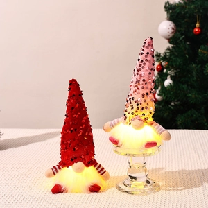 Light-up sequin Christmas gnome figurines in red and pink for holiday home decor