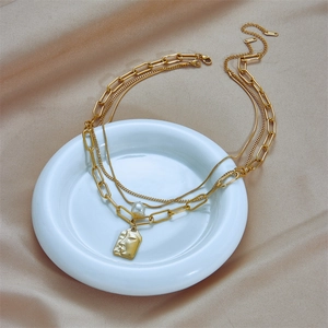 Vintage multi-layer gold titanium chain necklace with pearl and portrait face pendant