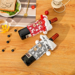 Knitted Christmas wine bottle covers with reindeer motif and white faux fur trim decor