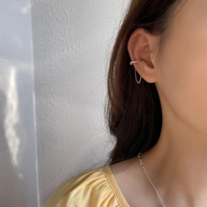 Minimalist S925 sterling silver ear cuff with delicate chain on model's ear