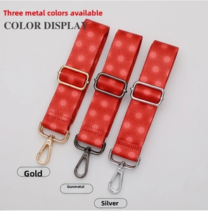 Ethnic style bag strap detail showing metal buckles in gold, gunmetal, and silver
