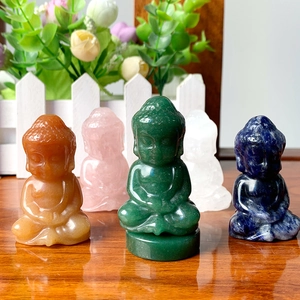 Detail showing five mini crystal Buddha figurines in green, pink, and blue stone carvings