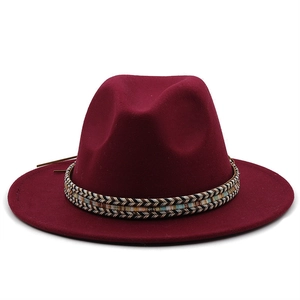 Detail of ethnic style braided band on a burgundy wool felt wide brim fedora hat