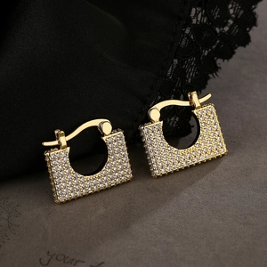 Luxurious gold-plated geometric earrings with micro-paved white zircon on a dark stone base