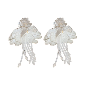 Elegant white petal earrings with crystal beads and long fringe tassels on white background