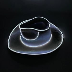 Detail of western cowboy hat featuring glowing white LED EL wire on black fabric