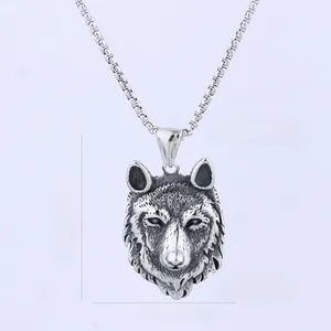 Detailed view of wolf head pendant with hair texture and dimensions 39mm by 27mm