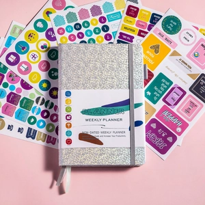 Detailed view of silver glitter weekly planner set with colorful decorative stickers