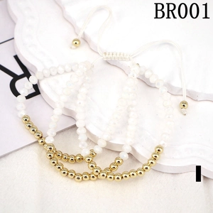 Close-up of a 3-piece white crystal bead bracelet set with adjustable woven gold drawstring