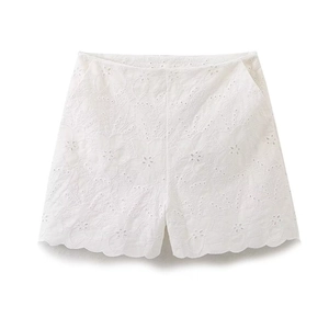 White high-waisted cotton shorts with floral embroidery and cut-out detailing on white back