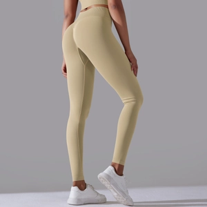 Detail view of high waist seamless yoga pants with scrunch butt lifting design in beige