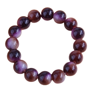 Elegant beaded bracelet with polished gradient purple and brown glass beads on white background