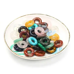 Assorted 20mm natural stone abacus beads in a white ceramic bowl for DIY jewelry