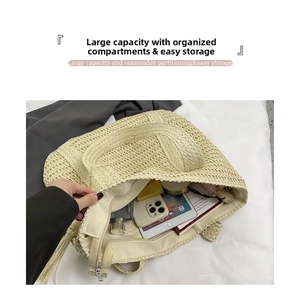 Interior view of beige straw tote bag showing large capacity and zipper pocket