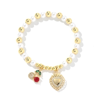 Close-up of pearl bead bracelet with red cherry charm and zircon heart pendant