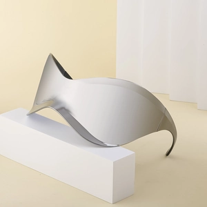Y2K rimless silver mirrored cycling sunglasses with futuristic aesthetic on white pedestal