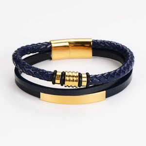 Detail view of multi-layer navy leather braided bracelet with gold magnetic metal clasp