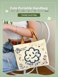 Canvas tote bag with cute cloud illustration and brown handles shown on a model
