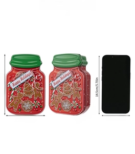 Size comparison of Christmas gingerbread man tin box with red and green holiday motifs
