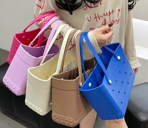 Detail showing various colors of EVA beach bags with signature holes and non-slip bottom