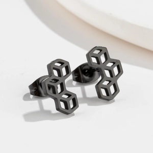 Detail shot of black geometric honeycomb stud earrings with matte stainless steel finish