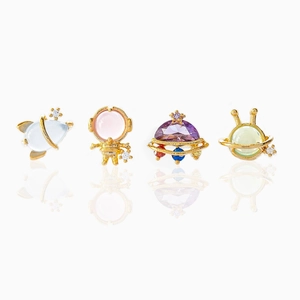 Space-themed stud earring set featuring astronaut, rocket, and planet designs in gold finish