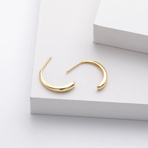 Detailed macro view of gold plated S925 sterling silver minimalist hoop earrings